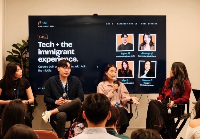 The Tech + the Immigrant Experience panel on stage